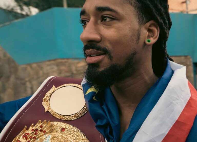 Demetrius Andrade Pictured Wrapping The Cabo Verde Flag Around His Neck With His Belt On His Shoulder