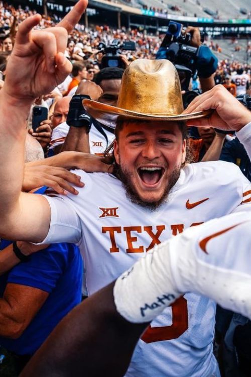 The Texas QB Quinn Ewers Pictured Celebrating With Texas Fans Last Year In October 