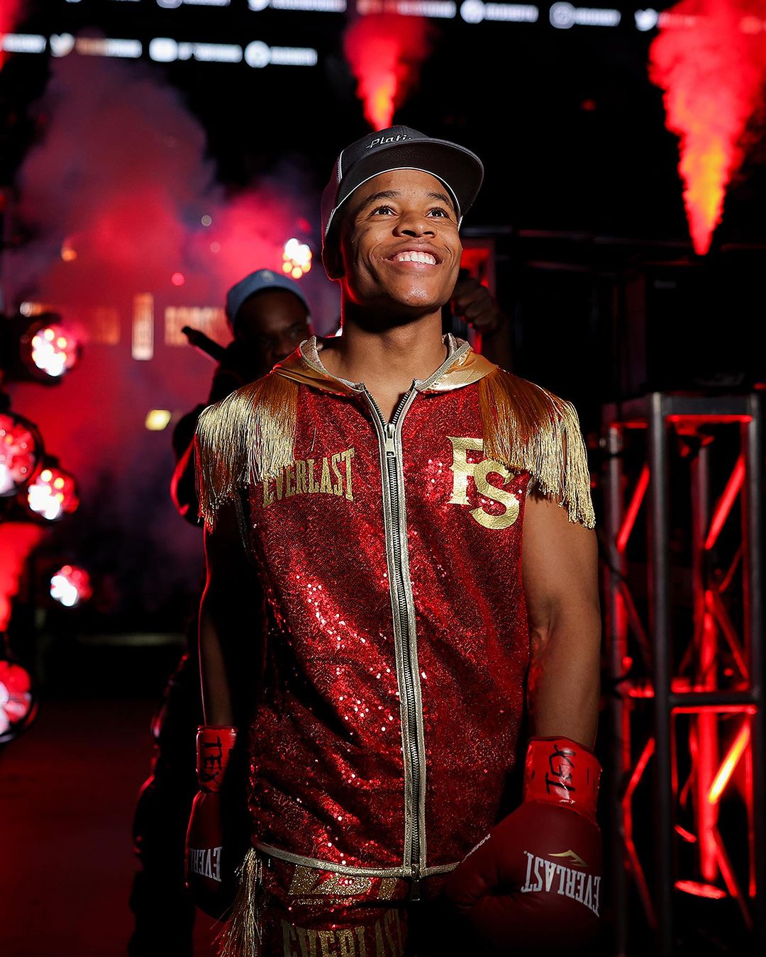 Floyd Dresses In A Red Glittered Outfit With Cap And Completes His Look With A Dazzling Smile