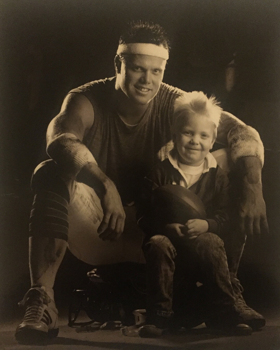 Jim McMahon Posing With His Young Son, Sean