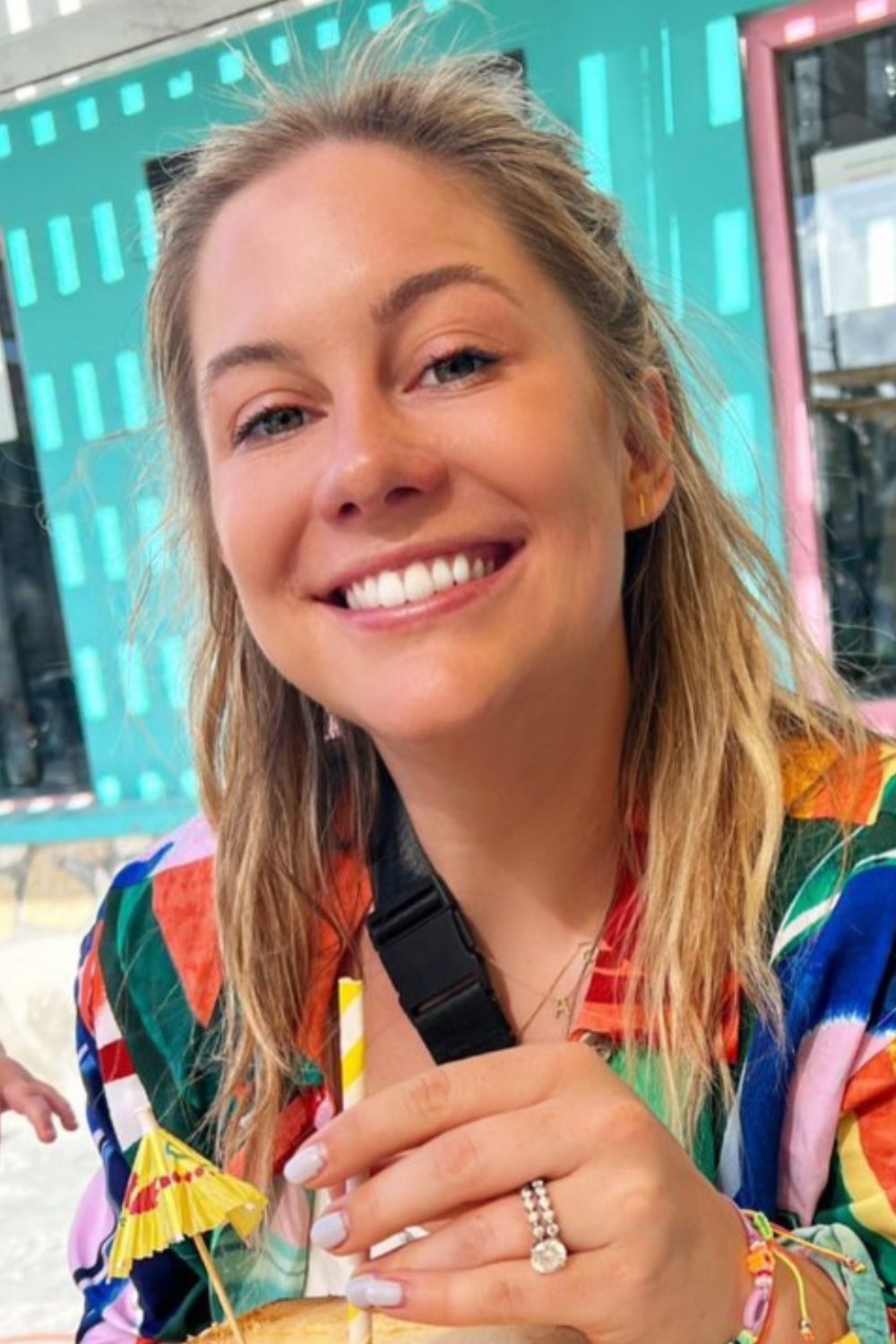 Shawn Johnson smiling brightly in a beautiful dress