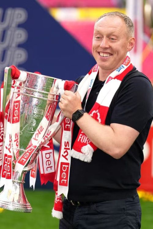 Steve Cooper Carrying A Trophy That He Won