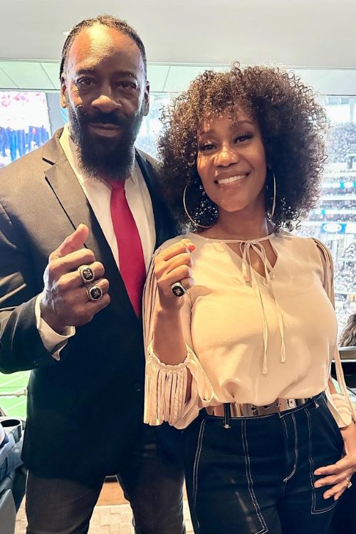 Booker T And Sharmell Show Off Their Ring As They Attend A Football Game At AT&T Stadium