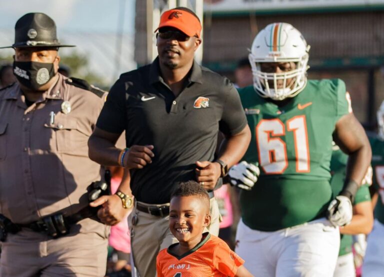 The FAMU Head Coach Willie Simmons Seen Leading Out The Pack With His Son