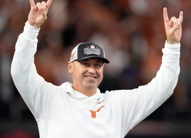 Steve Sarkisian Looks At The Texas Crowd And Celebrates With The Signature Pose
