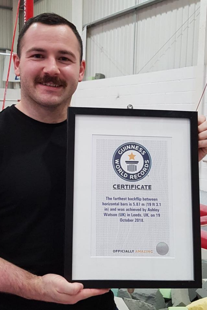 Ash Watson Holding His First Guinness World Record Certificate