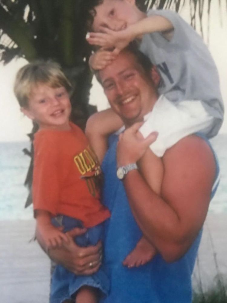 Childhood Picture of Maxx And His Brother Myles With Their Father