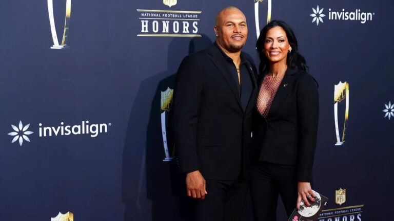 Antonio Pierce posing with his wife