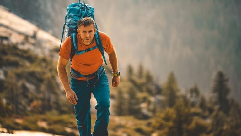Tommy Caldwell climbing carrying huge bag