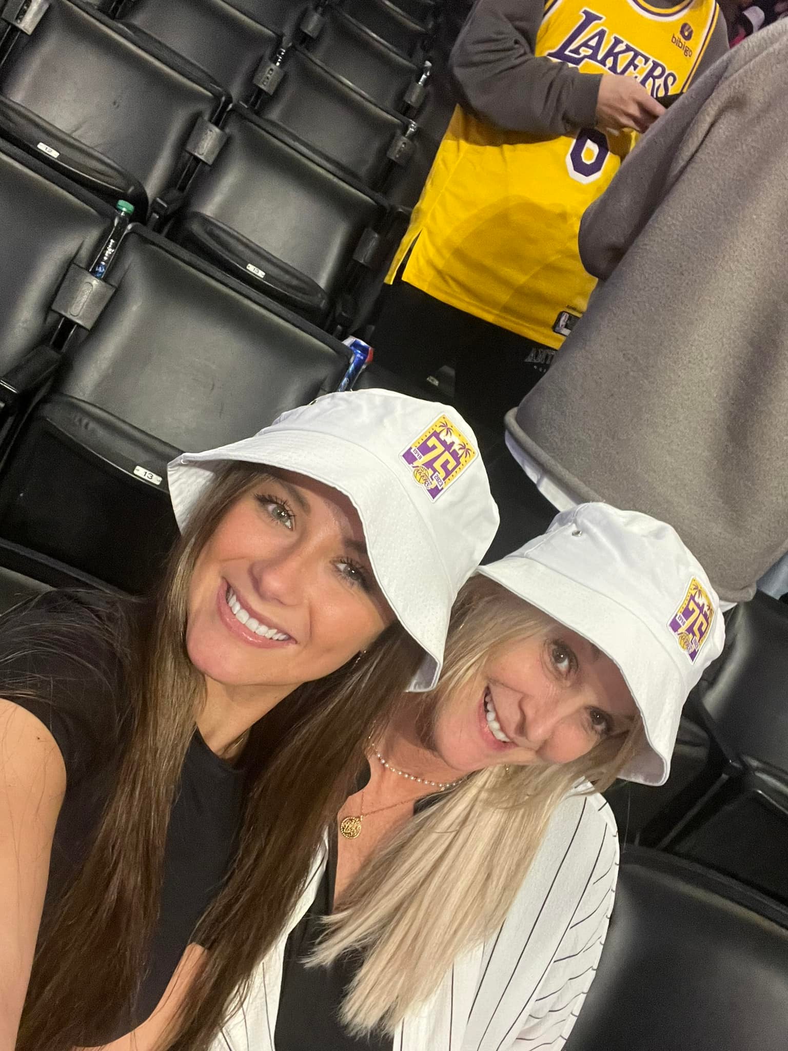 Austin Reaves' girlfriend Jenna Barber (left) with her mom, Nicole Wilkett, at a 2023 game