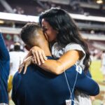 Marcus Freeman’s and his wife Joanna Freeman embrace in a celebratory hug