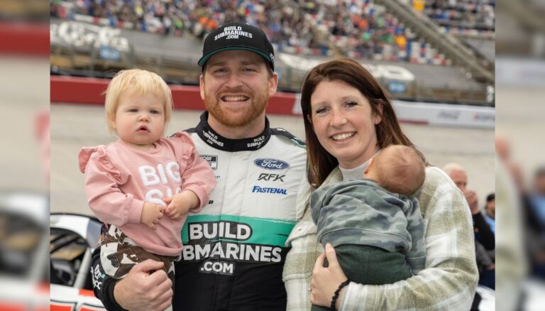 Chris Buescher with his wife, Emma, and their two kids