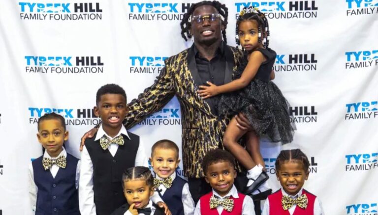 Tyreek Hill with his seven kids