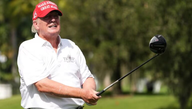 Donald Trump wearing MAGA cap and playing golf