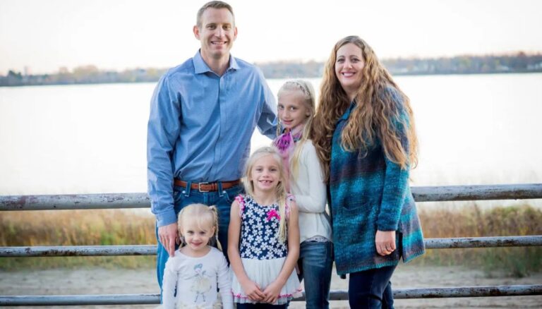 Nate Oats with his wife Crystal and three daughters