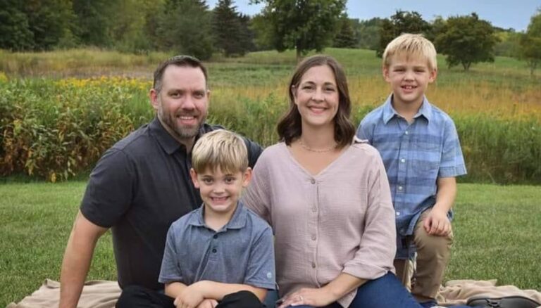 The late hockey coach Mike Betker with his wife Laura and two sons