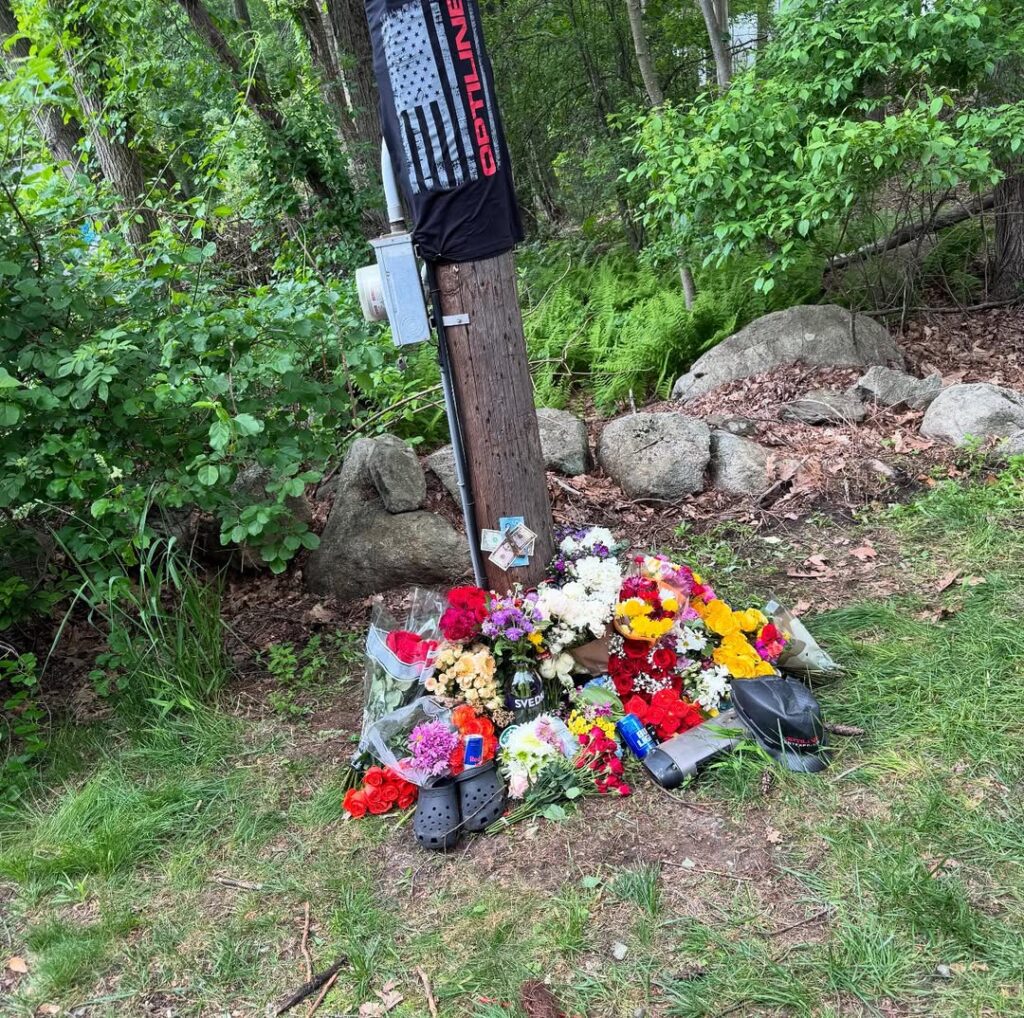 Friends and family gathered along Wallace Road to create a roadside memorial for Tyson.