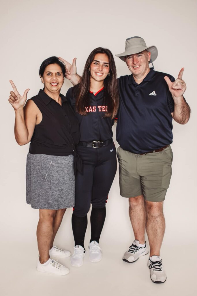 Lauren Allred posing with her parents