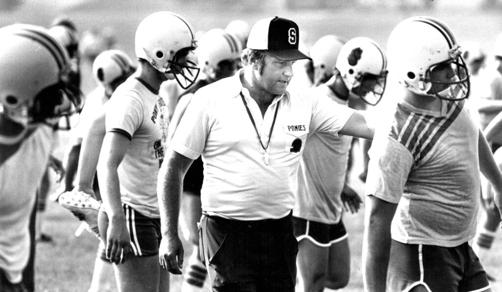 George Thole supervises conditioning before Stillwater's 1982 season.