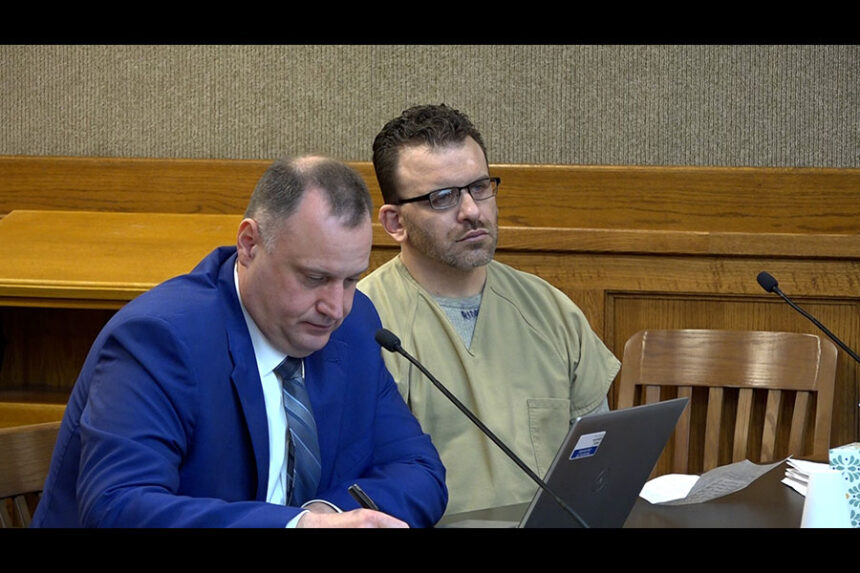 Serhiy Stavynskyy (left) and Maxie Riddle (right) during his sentencing on Sept. 15 before District Judge Dane Watkins Jr.